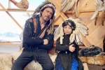 Shah Rukh Khan, Shah Rukh Khan, shah rukh khan and his son abram trolled for sporting native american war bonnets, Native american