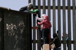 punjabis Crossing Border Fence, punjabis Crossing Border Fence, video clip shows punjabi women children crossing border fence into u s, Mexico border